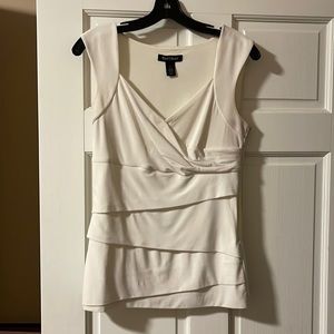 Very fitted sleeveless blouse